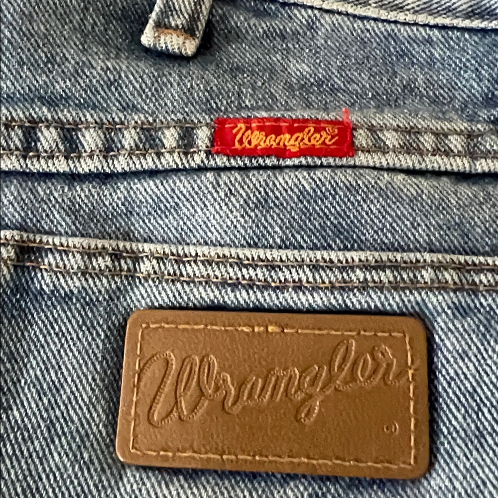 Wrangler Light Blue Denim Boot Cut Jeans with Brown Leather Patch and Red Tag